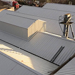 Removal of asbestos cement roofing and replacement with Kingspan KS1000RW insulated roof 