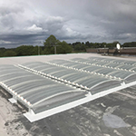 Replacement of old rooflights with Brett Martin GRP Multivault lights and on site GRP to upstands
