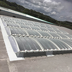 Replacement of old rooflights with Brett Martin GRP Multivault lights and on site GRP to upstands