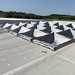 Replacement of old rooflights with Brett Martin GRP Multivault lights and on site GRP to upstands