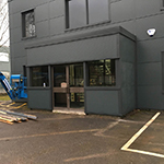 Steel framed office extension complete with cladding and overcladding of the old concrete structure with Kingspan KS1000 MR micro rib insulated panels