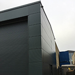 Steel framed office extension complete with cladding and overcladding of the old concrete structure with Kingspan KS1000 MR micro rib insulated panels